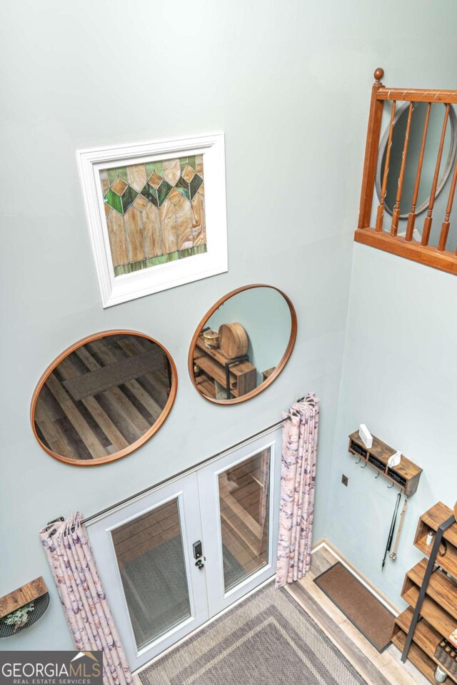 corridor with hardwood / wood-style floors