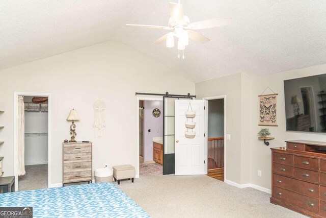 bedroom with vaulted ceiling, ceiling fan, and carpet