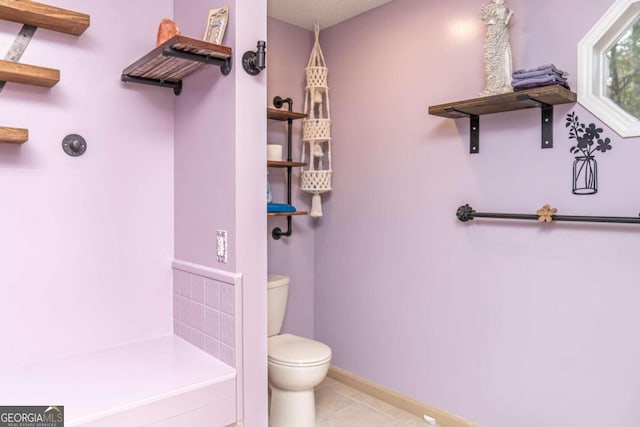 bathroom featuring tile patterned floors and toilet