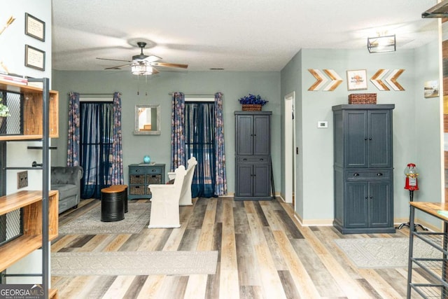 foyer featuring hardwood / wood-style floors and ceiling fan