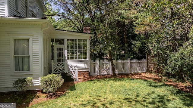 view of yard featuring a sunroom