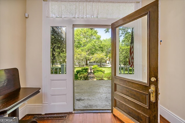 entryway with hardwood / wood-style flooring