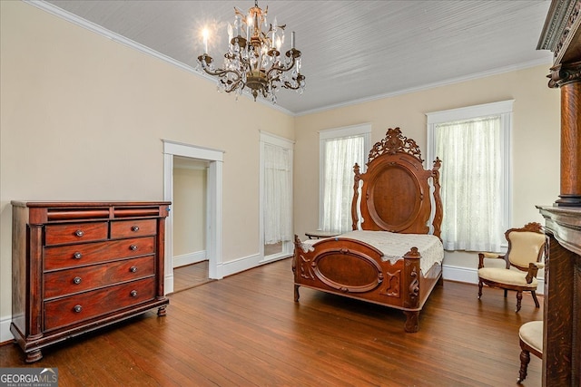 bedroom featuring hardwood / wood-style flooring, an inviting chandelier, and ornamental molding