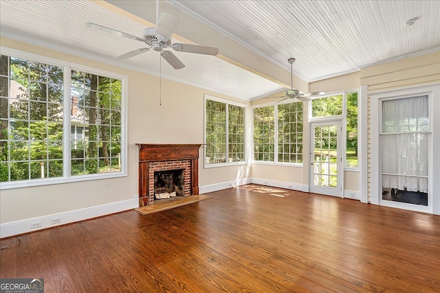 interior space with a fireplace, hardwood / wood-style floors, ceiling fan, and crown molding