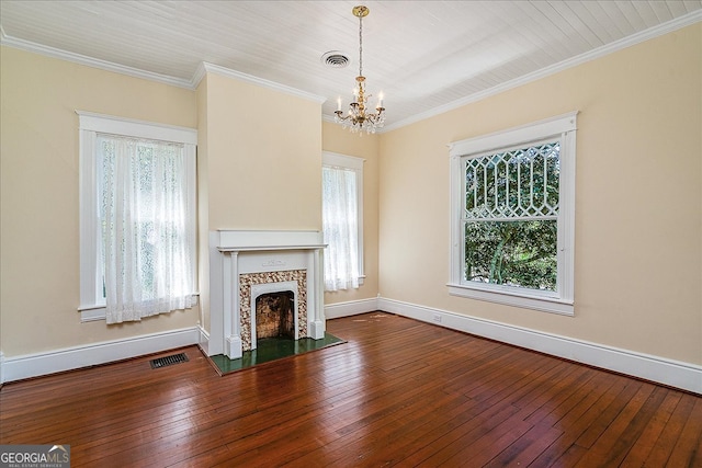 unfurnished living room with a chandelier, wood-type flooring, and crown molding