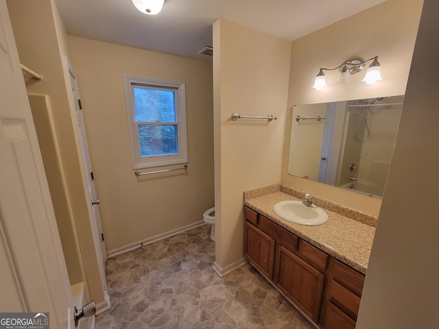 full bathroom featuring shower / washtub combination, vanity, and toilet