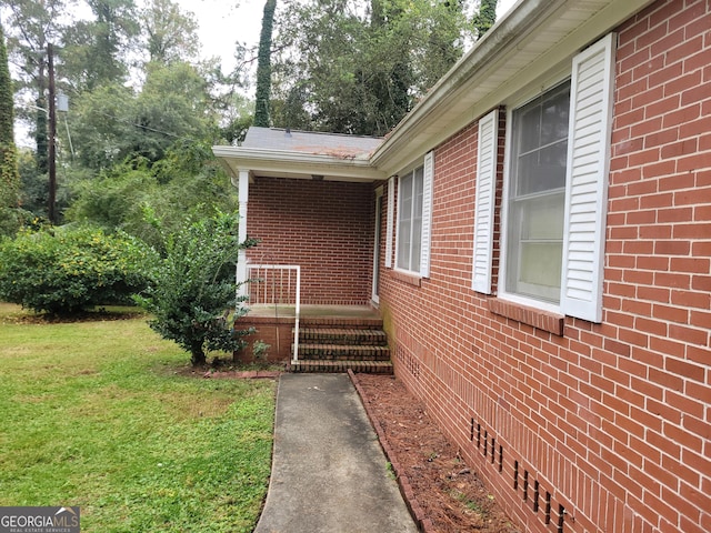 view of home's exterior with a yard