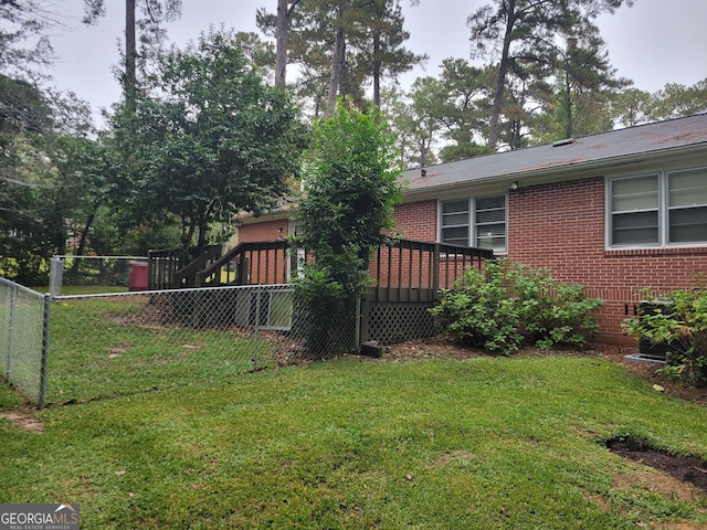 view of yard with a wooden deck