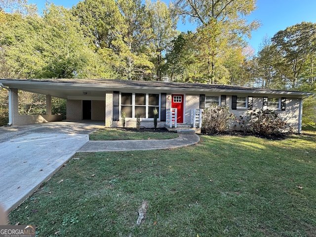 view of front facade with a front yard and a carport