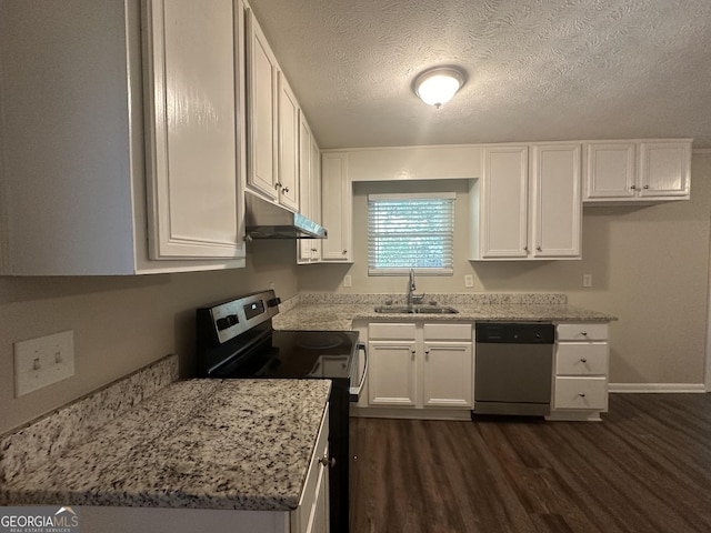 3850 Bright Star Rd, Douglasville, GA 30135 - kitchen with appliances with stainless steel finishes, a sink, under cabinet range hood, dark wood-style floors, and white cabinets