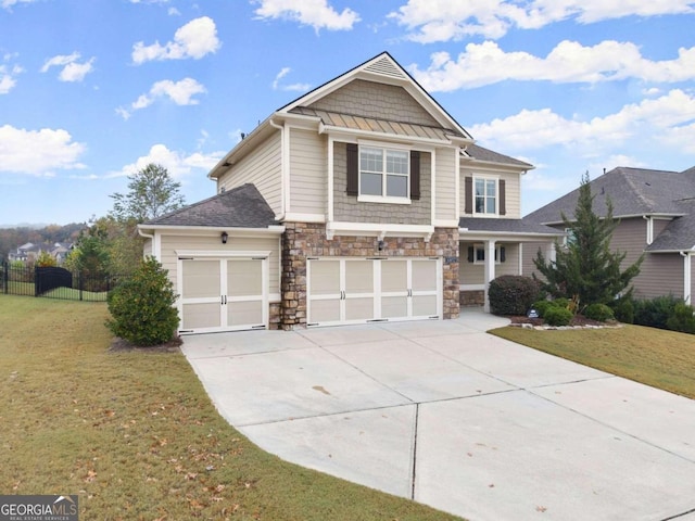 view of front of property with a garage and a front lawn