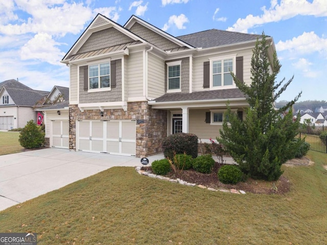 craftsman inspired home featuring a garage and a front yard