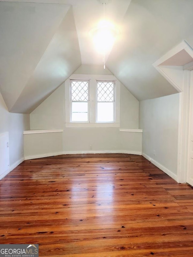 bonus room featuring hardwood / wood-style floors and lofted ceiling