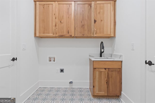 laundry area featuring cabinets, hookup for a washing machine, sink, and electric dryer hookup