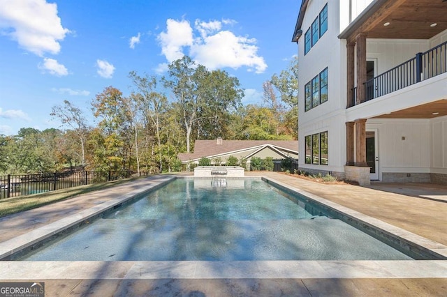 view of swimming pool featuring a patio