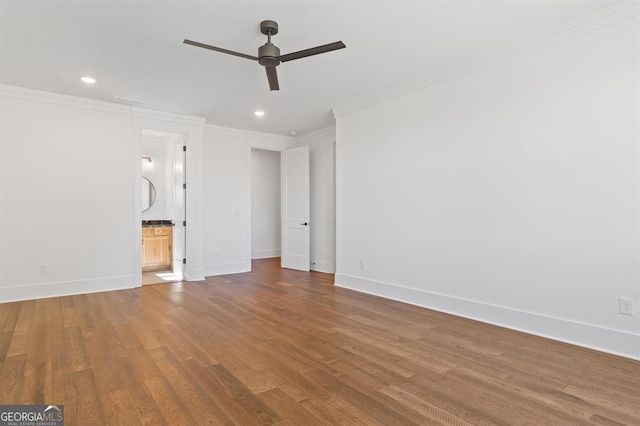 interior space featuring ceiling fan, wood-type flooring, and crown molding