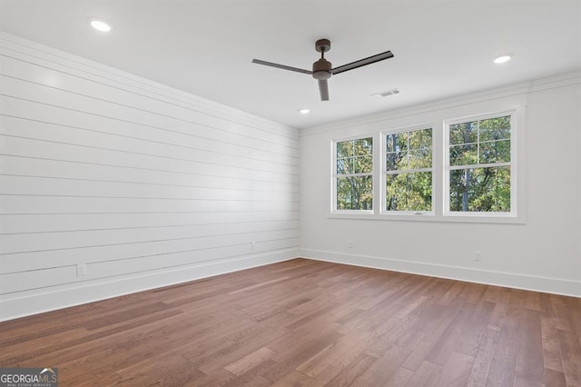 unfurnished room with ornamental molding, wood-type flooring, and ceiling fan