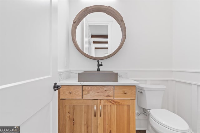 bathroom with vanity and toilet