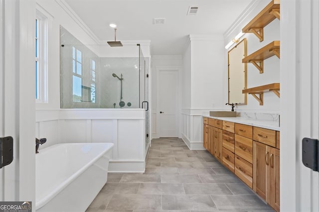 bathroom with crown molding, vanity, and separate shower and tub