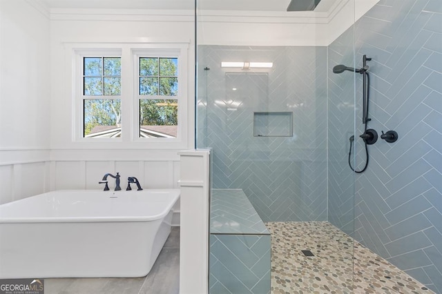 bathroom featuring separate shower and tub