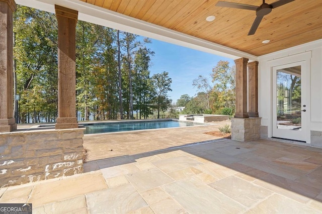 view of pool featuring ceiling fan and a patio