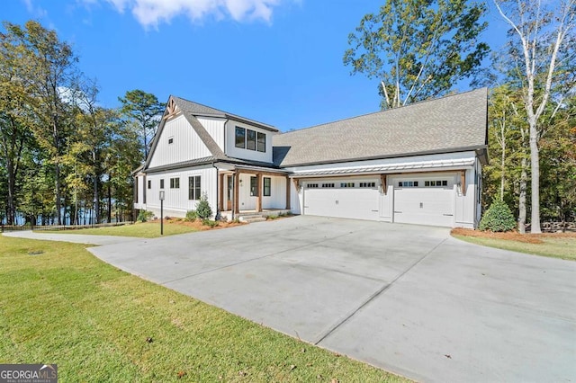 front of property with a front lawn and a garage