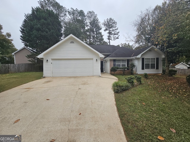 single story home featuring a front lawn, fence, concrete driveway, an attached garage, and brick siding