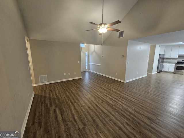 unfurnished living room with ceiling fan, visible vents, and dark wood finished floors