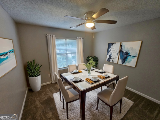 dining room with a textured ceiling, a ceiling fan, baseboards, and carpet floors