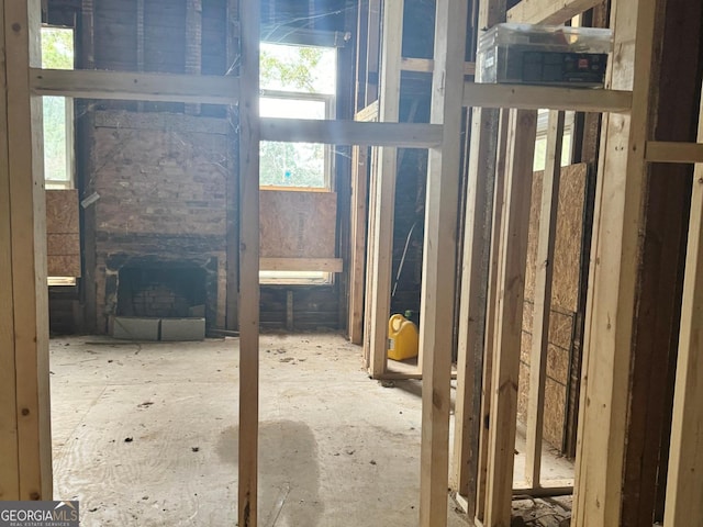 miscellaneous room featuring a stone fireplace