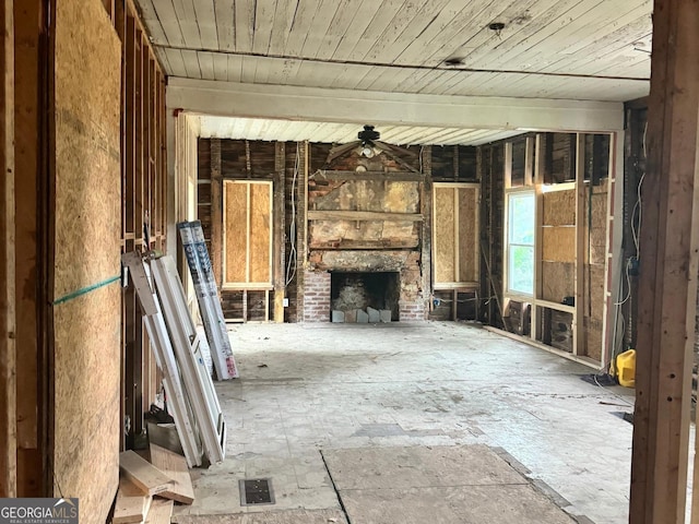 misc room with ceiling fan and a brick fireplace