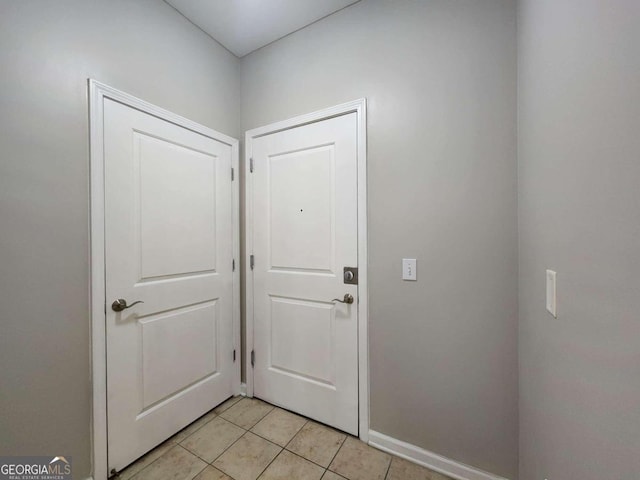 entryway with light tile patterned floors