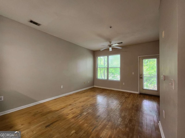 unfurnished room featuring hardwood / wood-style floors and ceiling fan