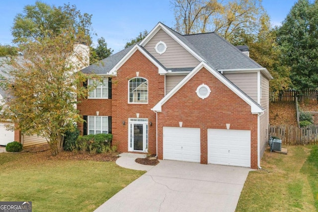 view of front property featuring a garage and a front yard