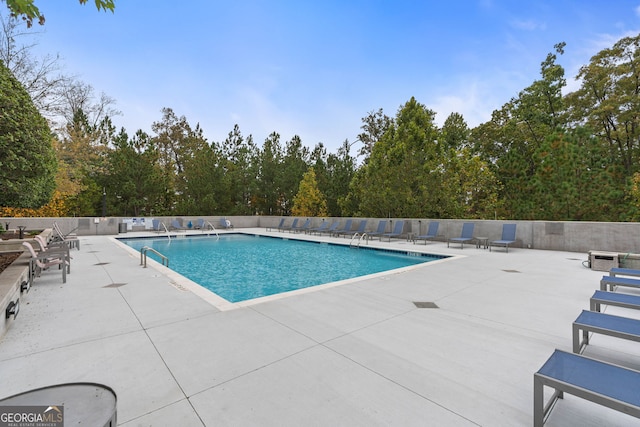 view of swimming pool featuring a patio