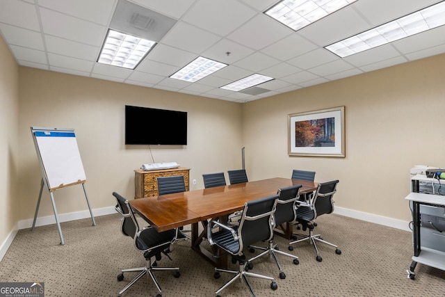 carpeted office space featuring a drop ceiling