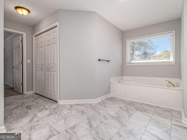 bathroom featuring a washtub