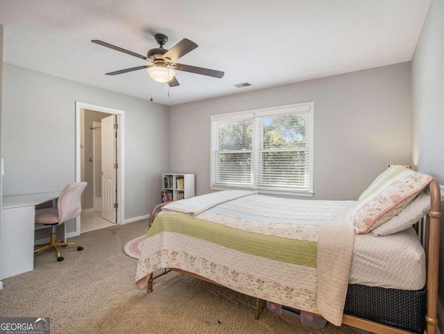 bedroom featuring ceiling fan, ensuite bathroom, and carpet