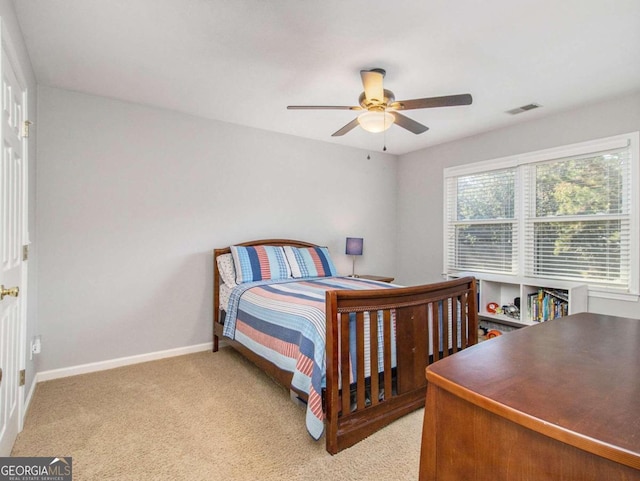 bedroom with light colored carpet and ceiling fan