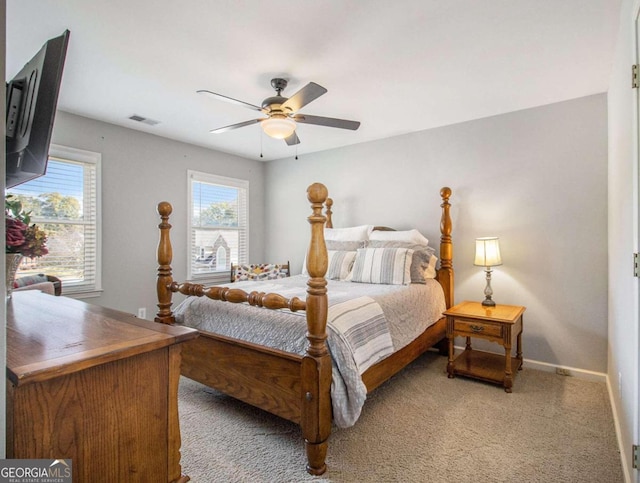 bedroom featuring ceiling fan and carpet