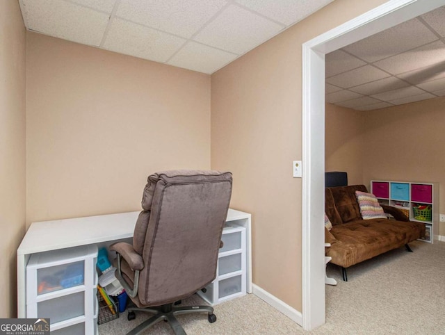 office area featuring a paneled ceiling and light carpet