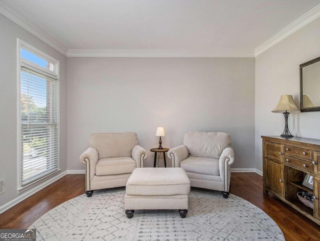 sitting room with hardwood / wood-style flooring and ornamental molding