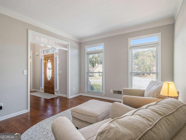 living room with ornamental molding and dark hardwood / wood-style floors