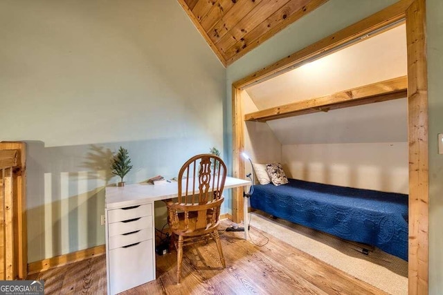 bedroom with hardwood / wood-style floors, wood ceiling, and vaulted ceiling