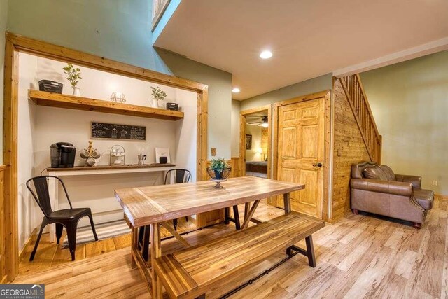 dining room with light hardwood / wood-style floors and ceiling fan