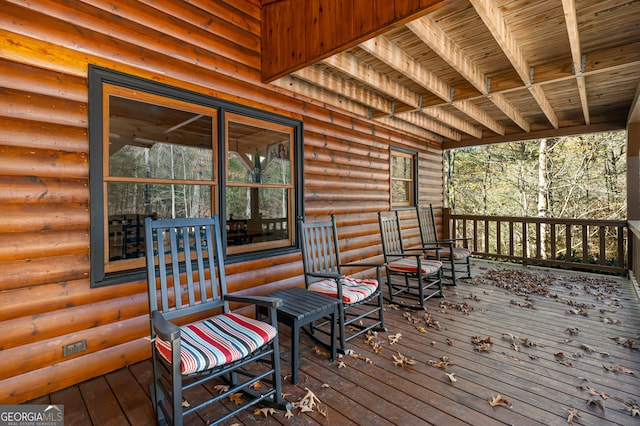 wooden terrace featuring a porch