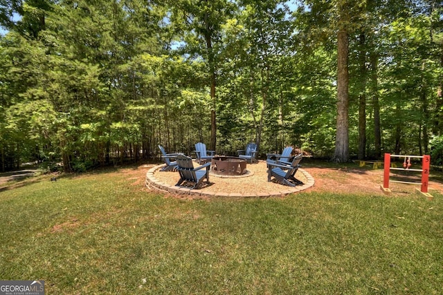 view of yard with an outdoor fire pit