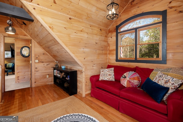 living room featuring wood-type flooring, vaulted ceiling, wooden walls, and wood ceiling