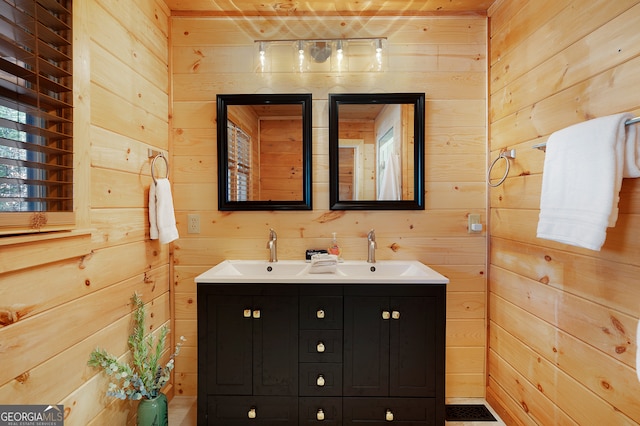 bathroom with wood walls and vanity