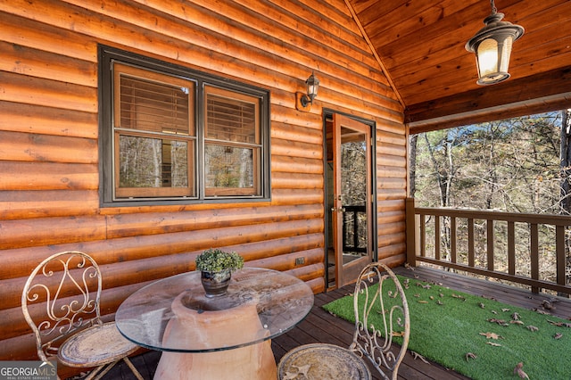 wooden terrace with a porch